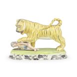 A Staffordshire model of a tiger mauling a child, circa 1820-30