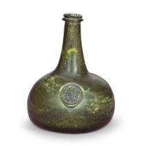 A very rare armorial sealed 'Onion' wine bottle, circa 1720