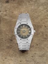 Audemars Piguet. A fine stainless steel automatic calendar bracelet watch with 'tropical' dial ...