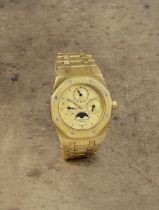 Audemars Piguet. A fine and rare 18K gold automatic perpetual calendar bracelet watch with moon ...