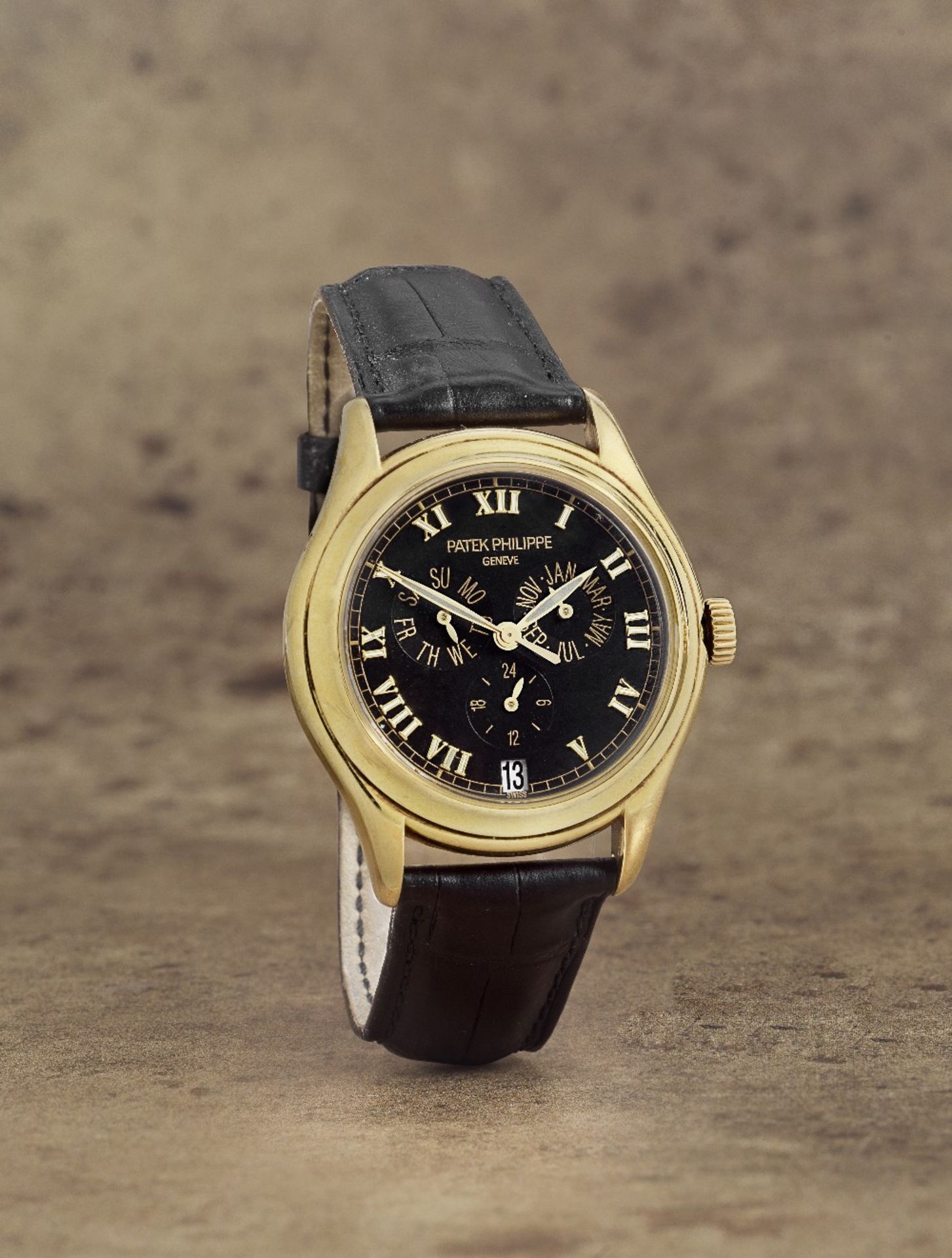 Patek Philippe. A fine 18K gold automatic annual calendar wristwatch with 24 hour indication Re...