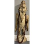 Antique hand carved African Tribal Figure, Elongated face, comes with nut necklace. [72cm high]