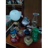 A Collection of various oil lamps