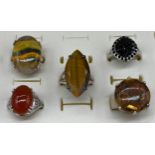 A Lot of five 925 silver and gem stone rings. Includes Tiger eye stone, Agate and black Iolite