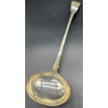 A Georgian Edinburgh silver large ladle produced by Andrew Wilkie. [36cm in length]