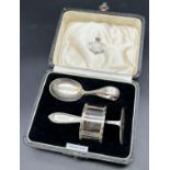 Birmingham silver boxed christening set. includes spoon, pusher and napkin ring.