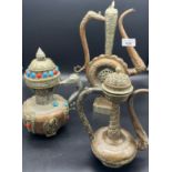 A Lot of three Tibetan tea pots, made from copper, brass and possible silver mounts. [Tallest 35cm]