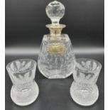 A Crystal decanter with a London silver collar and Sheffield silver drinks label. Together with