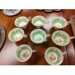 A Lot of 19th century tea cups detailed with a hand painted landscape. Together with two matching