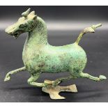 A bronze sculpture of the flying horse of Gansu . Signed to the inside. [16cm high]