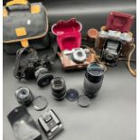 Three vintage cameras and lenses to include Carl Zeiss Ikon Compur Rapid bellow camera, Carl Zeiss