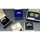 5 Various silver rings together with a pair of silver cuff links.