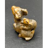 Hand carved Japanese Netsuke sculpture of a Mother Ram and baby on back. Signed. [4.5cm high]