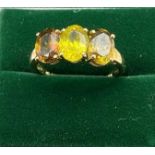 A Ladies 10ct yellow gold ring set with three large oval cut tourmaline stones. [Ring size R] [2.