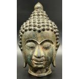 Antique Chinese Monumental Bronze head of Buddha Shakyamuni. Beautiful patina and detail showing.