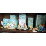 Shelf of Royal Doulton winnie the pooh figures includes Eeyore loses a tail , winnie the pooh