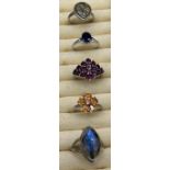 A Lot of 5 various 925 silver and gem stone rings. Includes Sapphire and white topaz ring & Orange