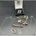 A Selection of silver jewellery to include Gate bracelet with various charms.