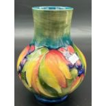 William Moorcroft leaf and berry design Baluster vase. [Small chip to rim] [Impressed factory and