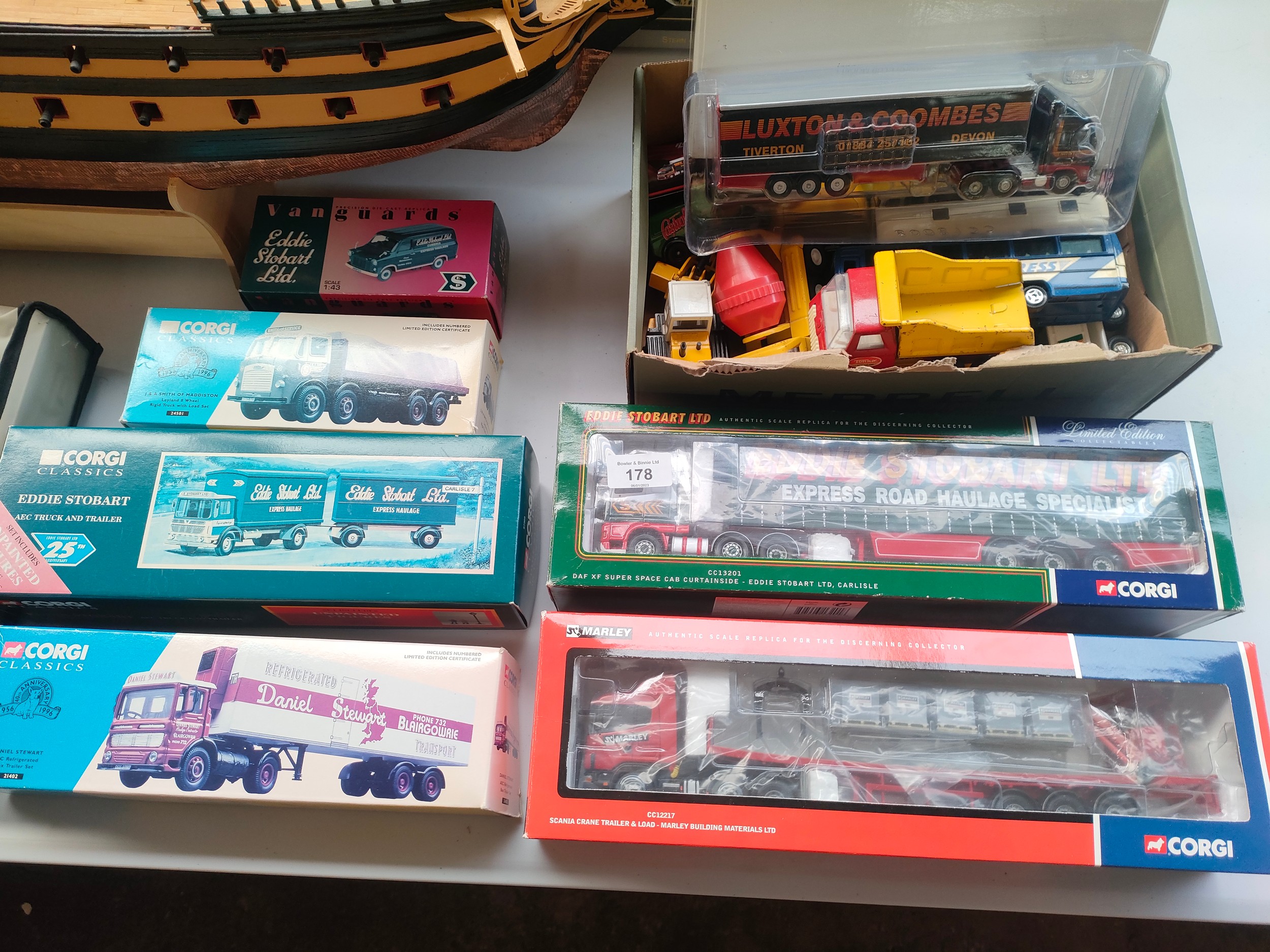 Selection of boxed truck models includes corgi Eddie Stobart together with box of loose vehicles