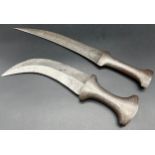 Two Antique decorative daggers. One possibly an Ottoman Dagger- engraved handle and blade. Curved