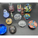 A Selection of mixed art glass paperweights. Includes two perfume bottles.