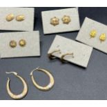 Six pairs of 9ct gold earrings.