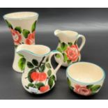 Four lots of Griselda Hill pottery [Wemyss Ware] includes vase, two cream jugs and sugar bowl.