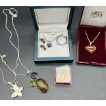 A Selection of silver chains and silver pendants. Includes 9ct gold cross pendant. A Ring, earring