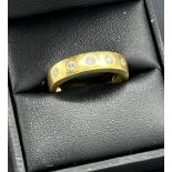18ct yellow gold ring set with five round cut diamonds. [Ring size O] [5.88Grams]