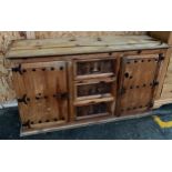 Solid Mexican Pine sideboard consists of three drawers and two doors.