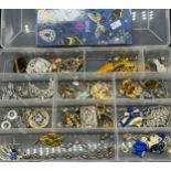 A Plastic box containing a quantity of costume jewellery to include brooches, Millefiori