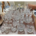 A Large quantity of crystal and glass ware to include vases, decanters and wine goblets.