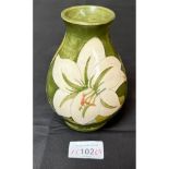A Moorcroft Bermuda Lily design vase. [Possibly been restored]