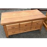 Contemporary light wood two drawer coffee table.