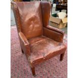 19th century Rustic brown leather arm chair.