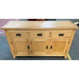 Contemporary light oak sideboard, consists of three drawers and three doors.