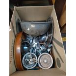Box of silver plate items, kitchen cutlery and porcelain cooking dishes.