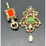 Victorian ornate gold tone pocket watch key fitted with green stone and red agate. Together with