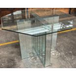 Contemporary table, the octagonal glass top above a mirror X base table [Originally used in a