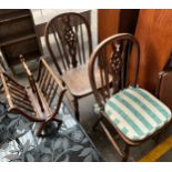 Two wheel back chairs together with magazine rack