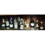 Shelf of miniatures to include Lagavulin 16 years aged, 10 years aged Auchentoshan and cream