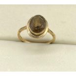 9ct yellow gold ring set with a smokey quartz stone. [Ring size O] [2.82grams]