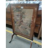 Antique fire screen fitted with house embroidery panel