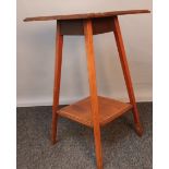 Edwardian two tier window table, the square top with parquetry inlay, above an opposing shelf,