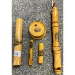 A Selection of Mauchline ware to include needle holders, thread dispenser and whistle.