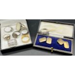 Collection of silver dress rings together with a pair of gold on silver cuff links with box.