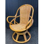 Retro Bamboo swivel arm chair.