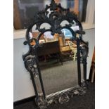 A Contemporary Hall mirror in Dark Wood Mirror with ornate scrolls and flowers with mirrored back