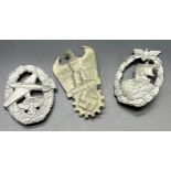 Three assorted reproduction German WW2 badges.